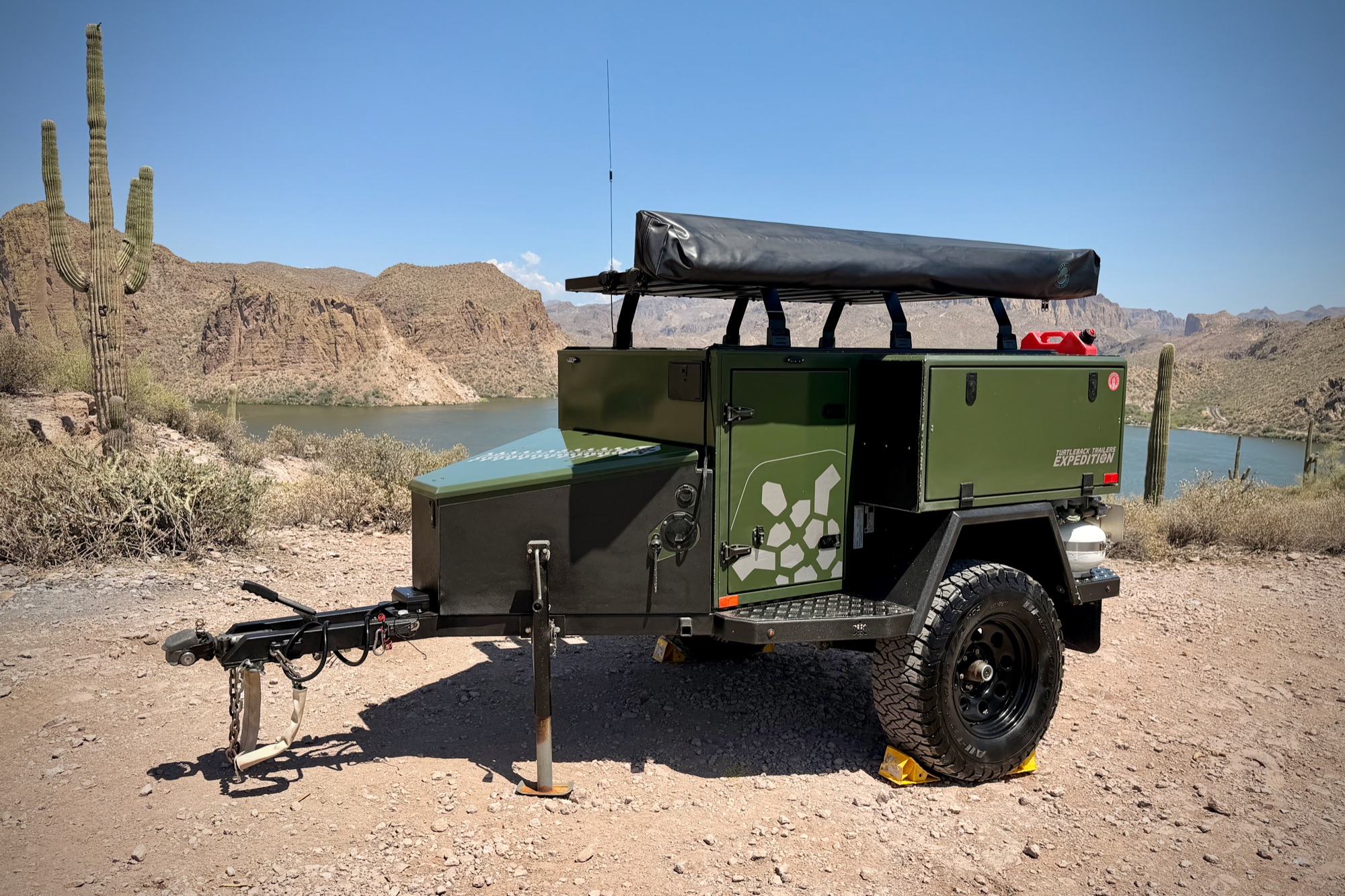 Driver-side three-quarter — the full rig at the lake