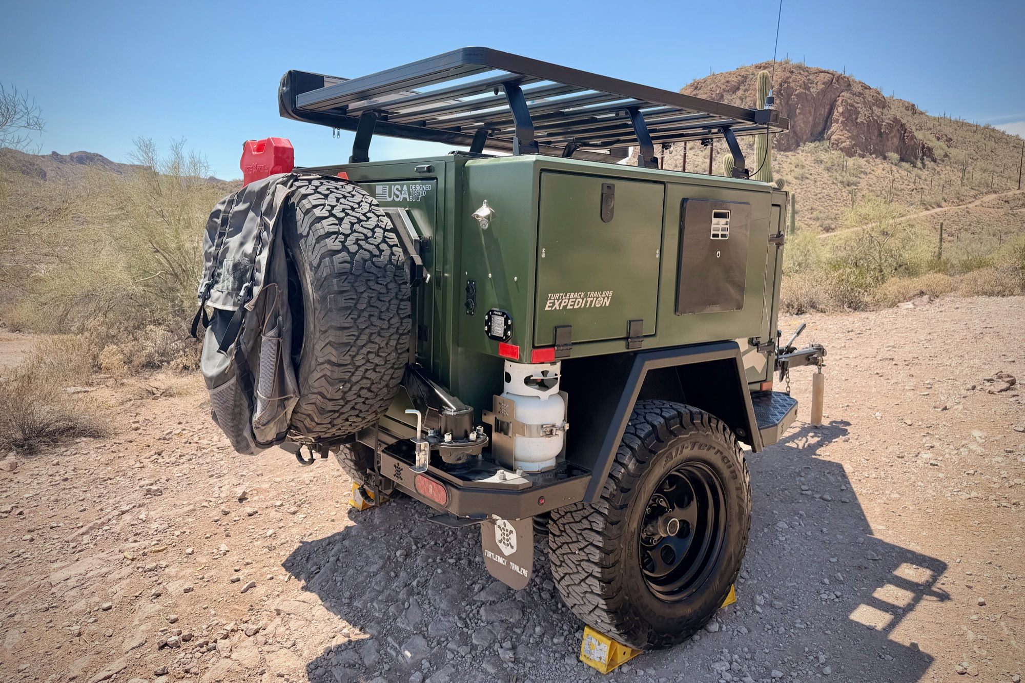 Rear three-quarter — spare swing-arm and propane