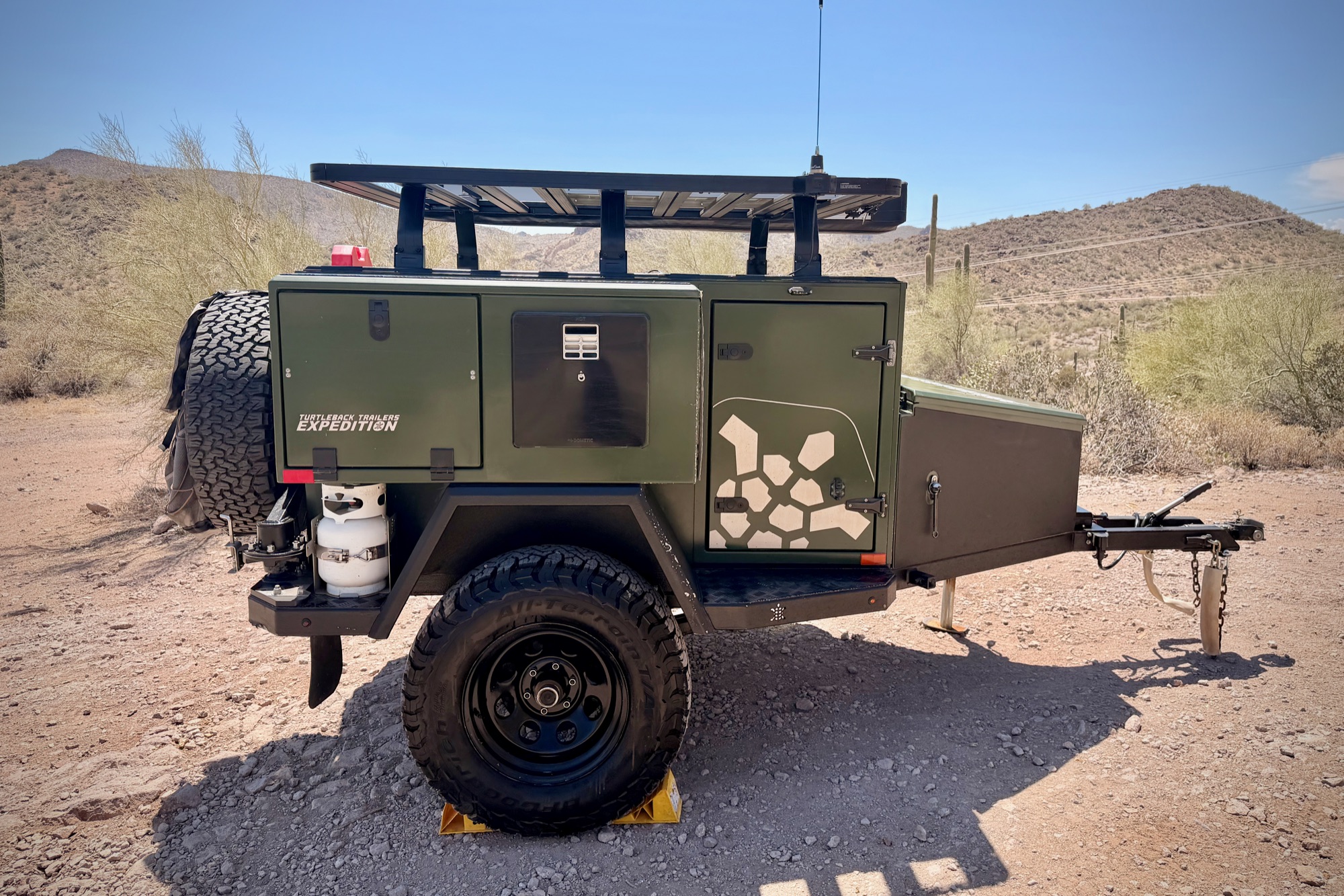 Full passenger-side profile in desert terrain