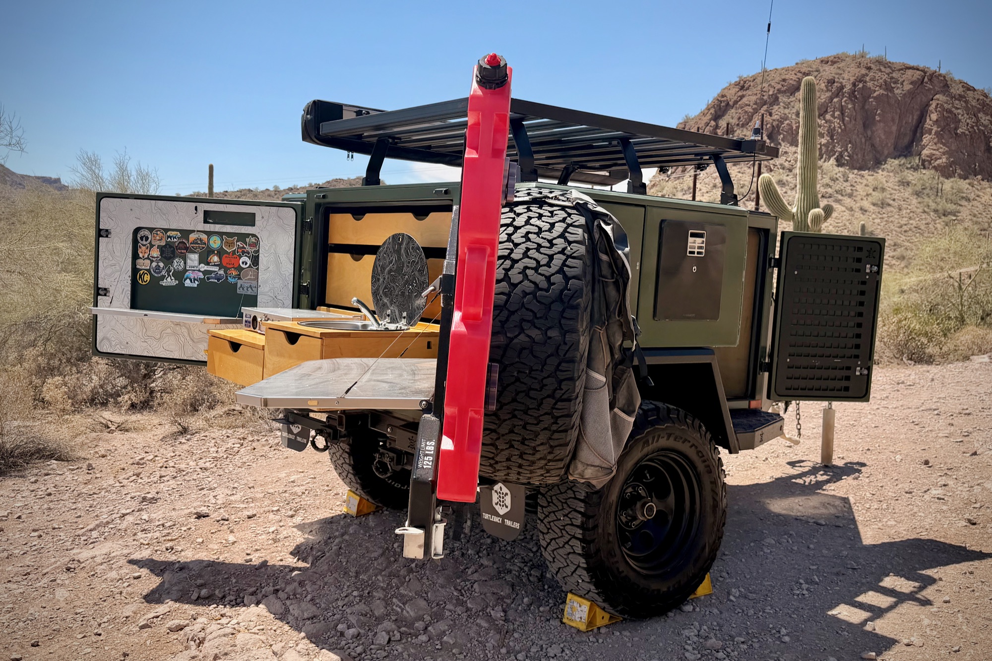 Hi-Lift jack, spare, and roof rack at the rear