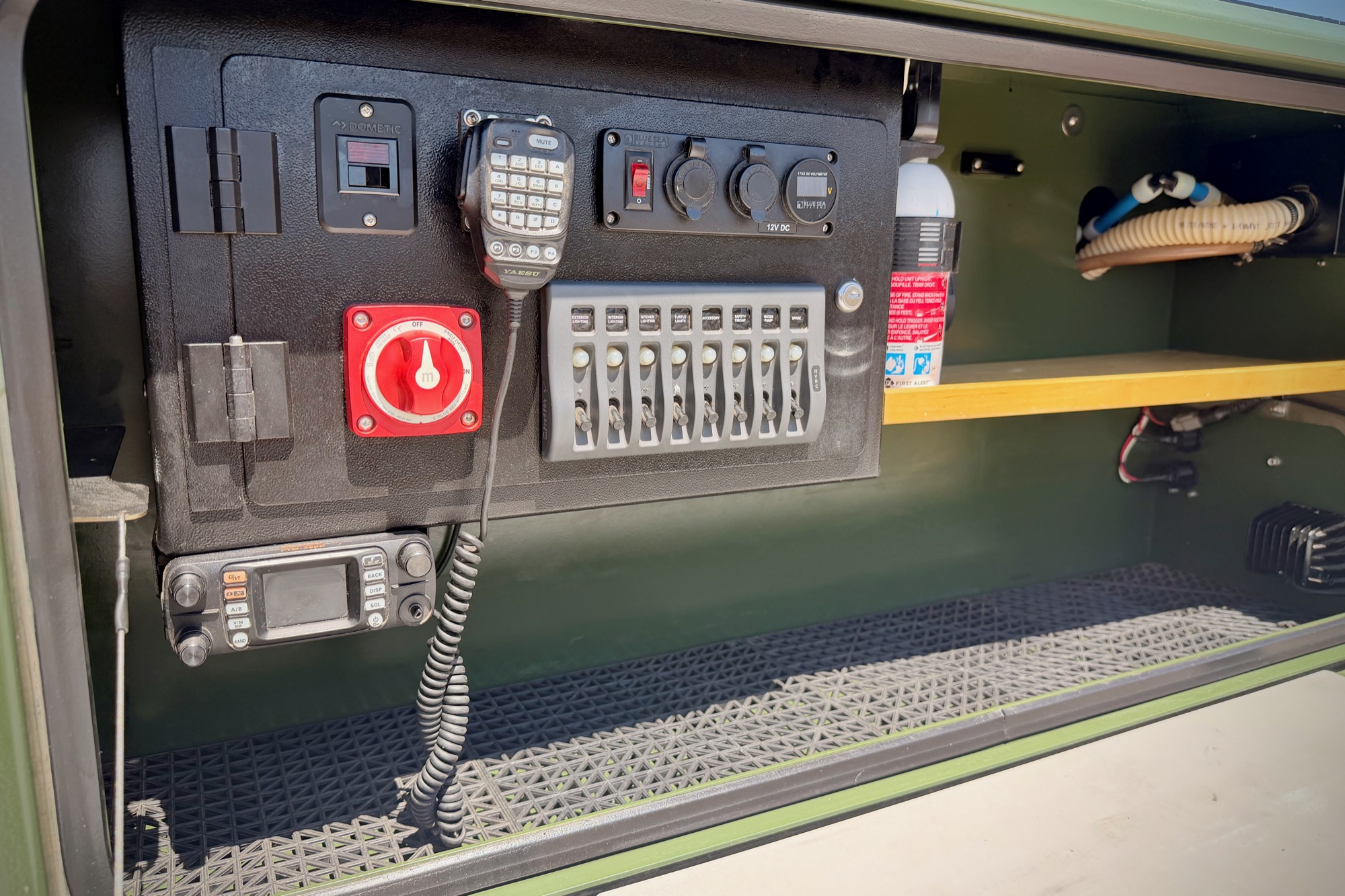 Electrical bay — disconnect, fuse bank, 12V outlets, radio
