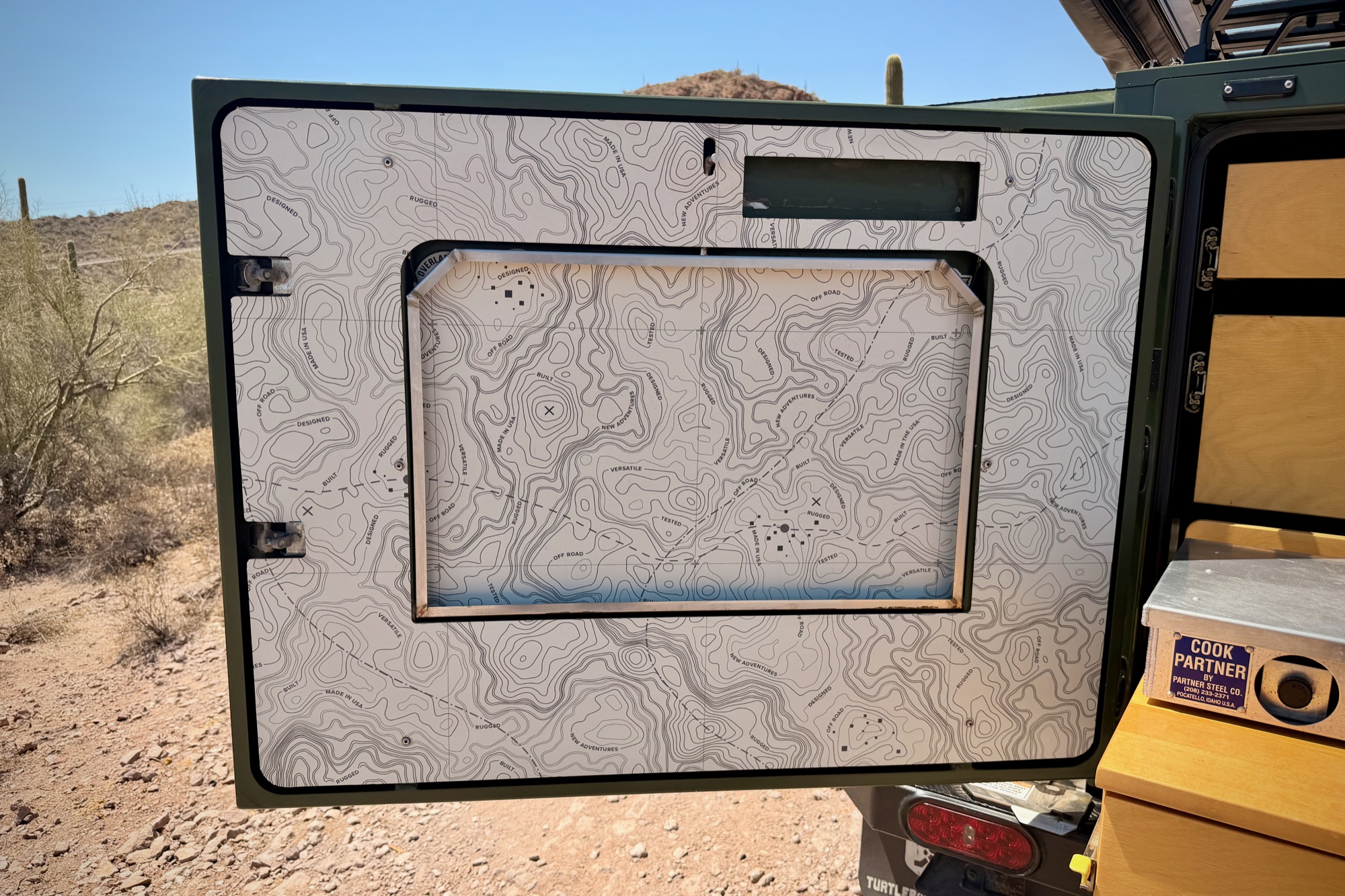 Side door interior — topo-map liner and screen panel